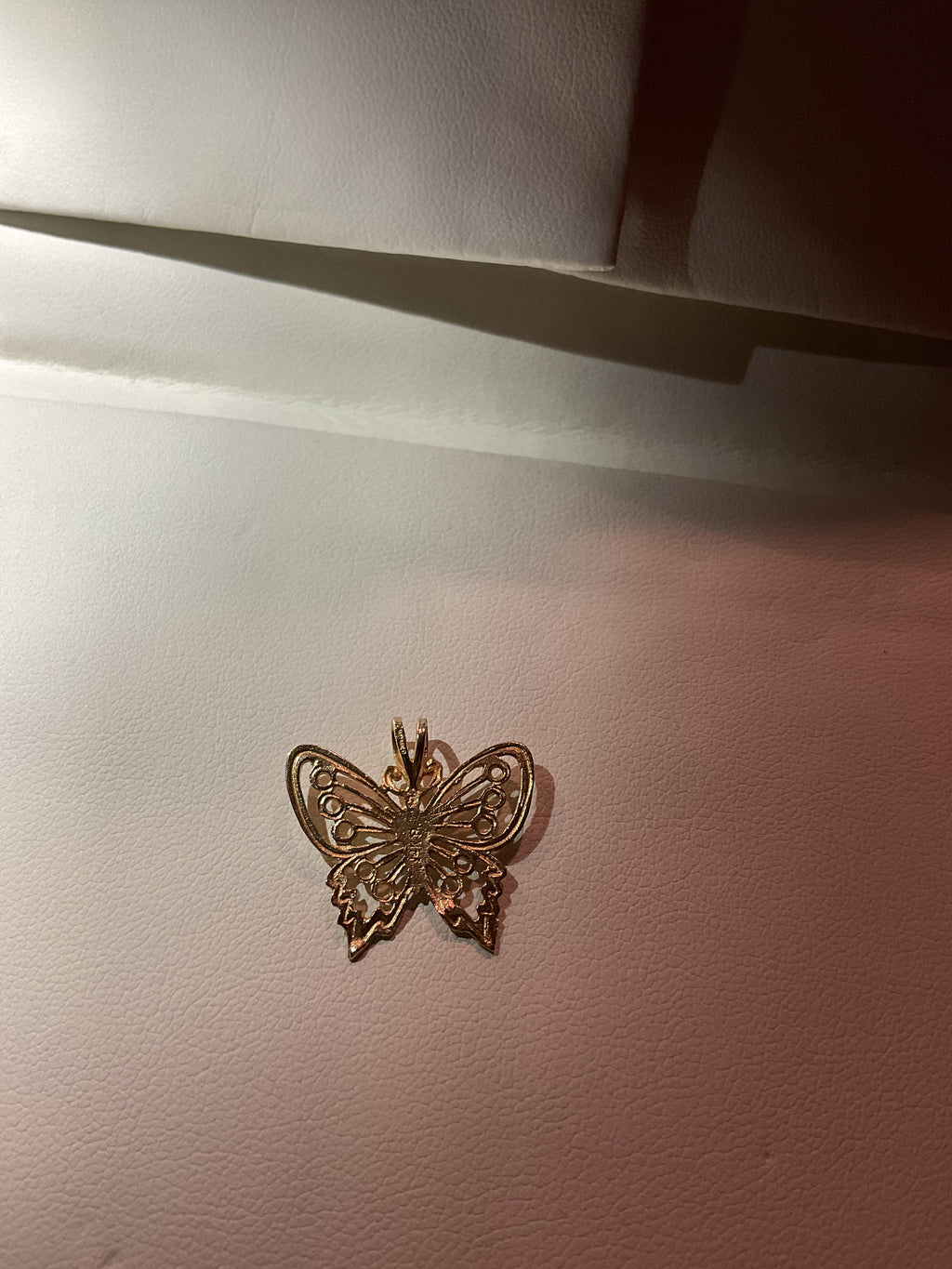 Butterfly pendant set in 14 karat gold