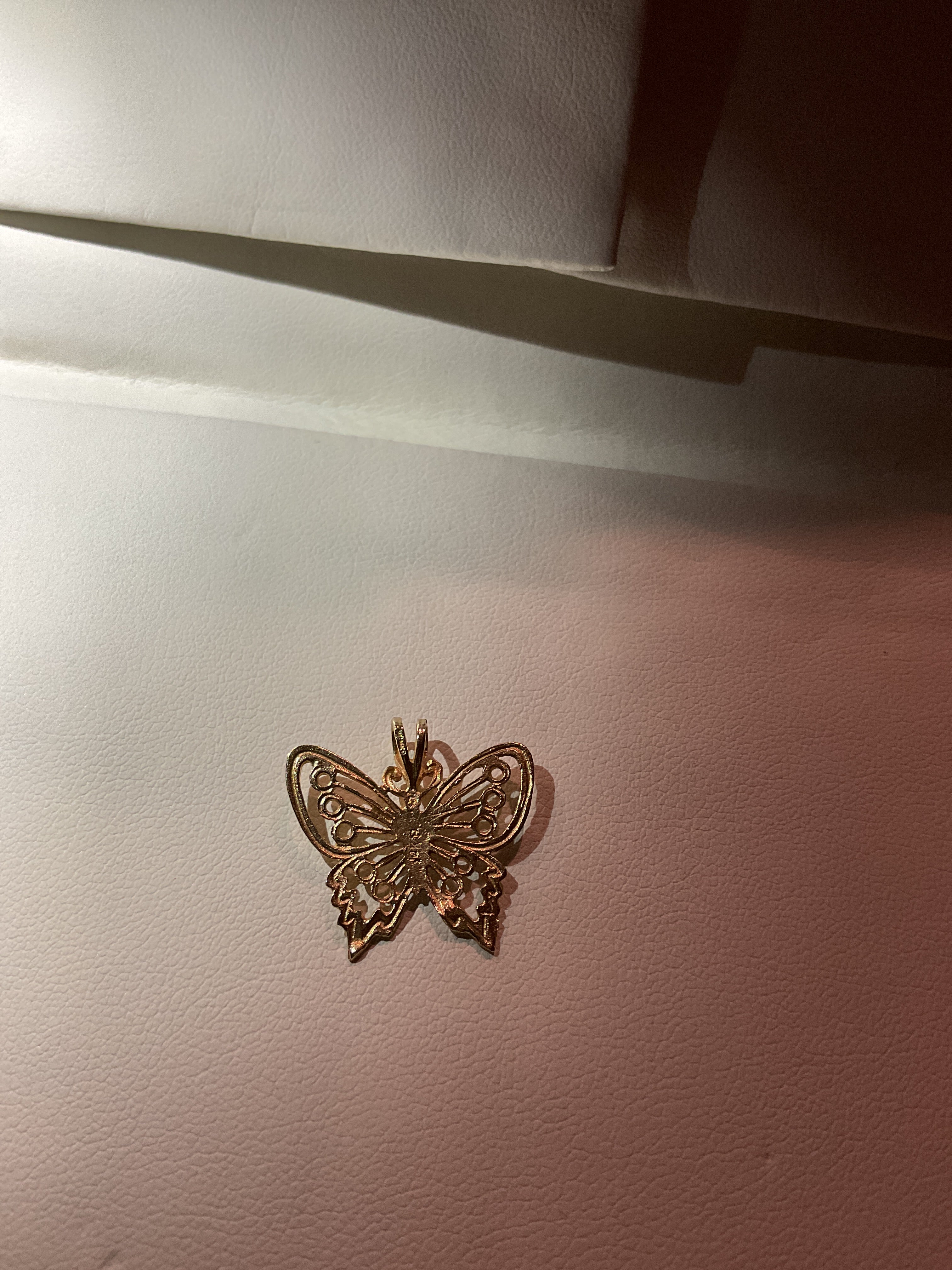 Butterfly pendant set in 14 karat gold