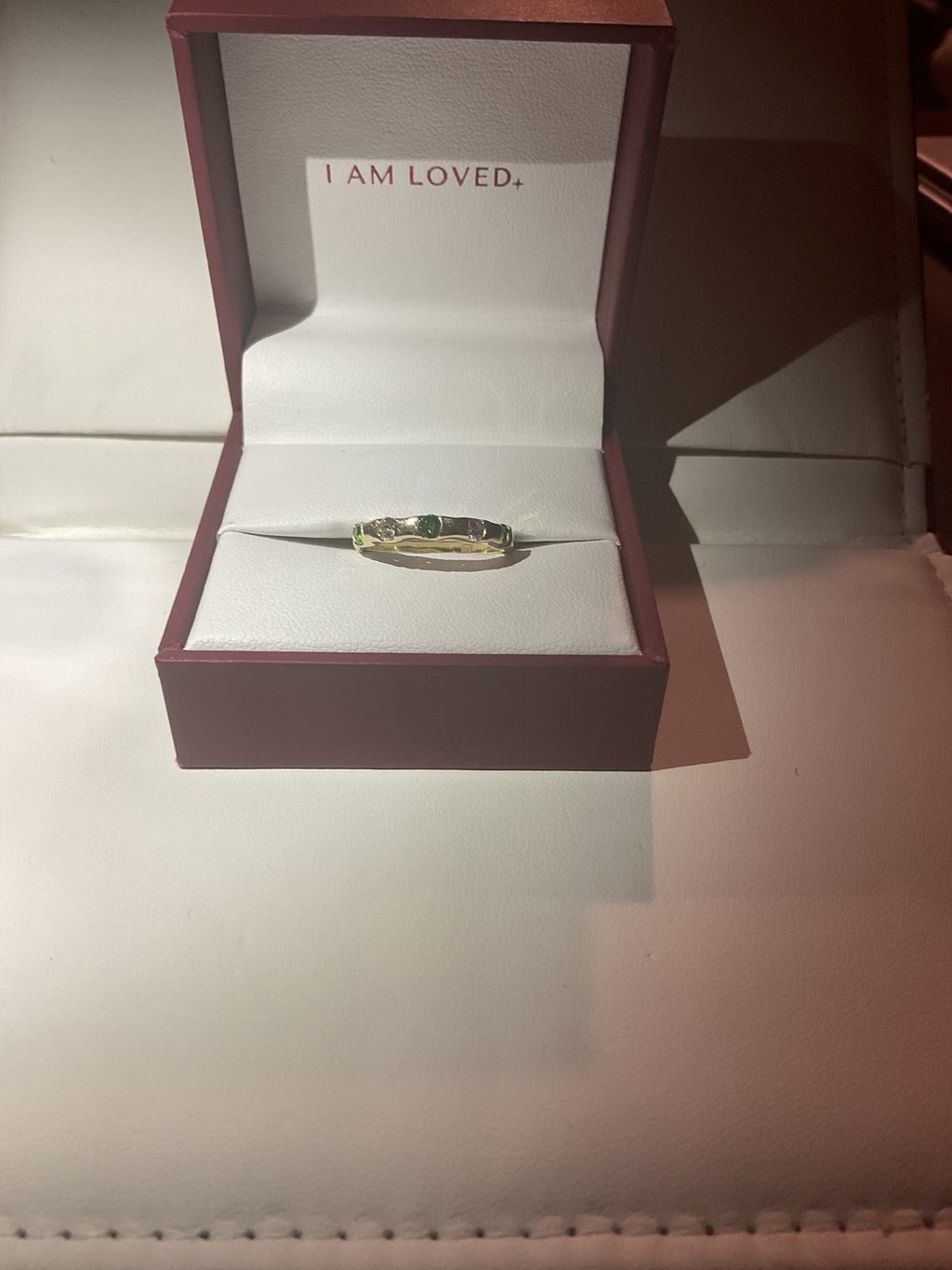 Ring with 3 tsavorite stones and 2 natural diamonds set in 14k Gold
