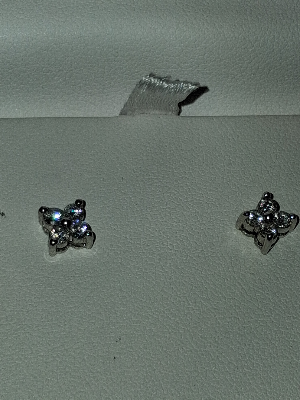 Platinum earrings set high quality natural diamonds 1.4 grams total weight. 💎0.25–0.35 ct per earring → ~0.50–0.70 carat total weight (CTW) for the pair. I had posts moved to middle of earrings so they are unisex.