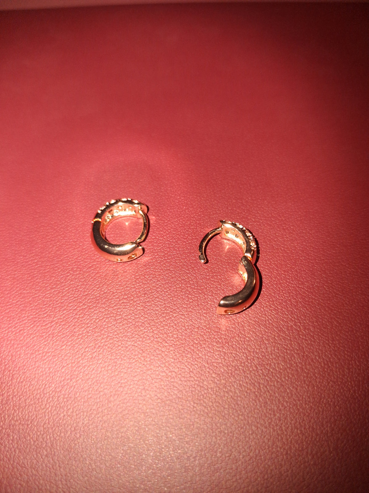 New & Beautiful woman's hoop earrings. "Costume" stones are cz.