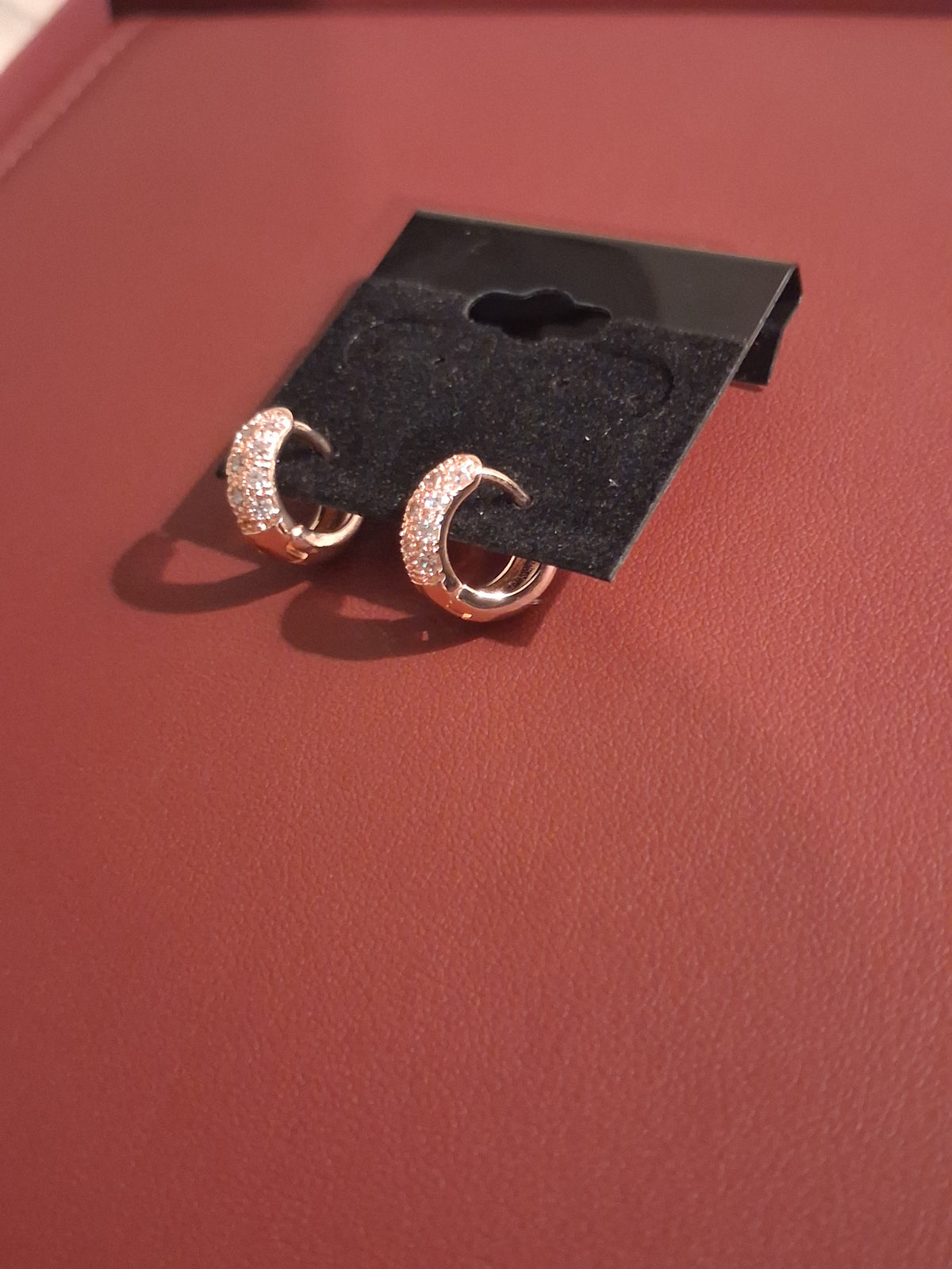 New & Beautiful woman's hoop earrings. "Costume" stones are cz.