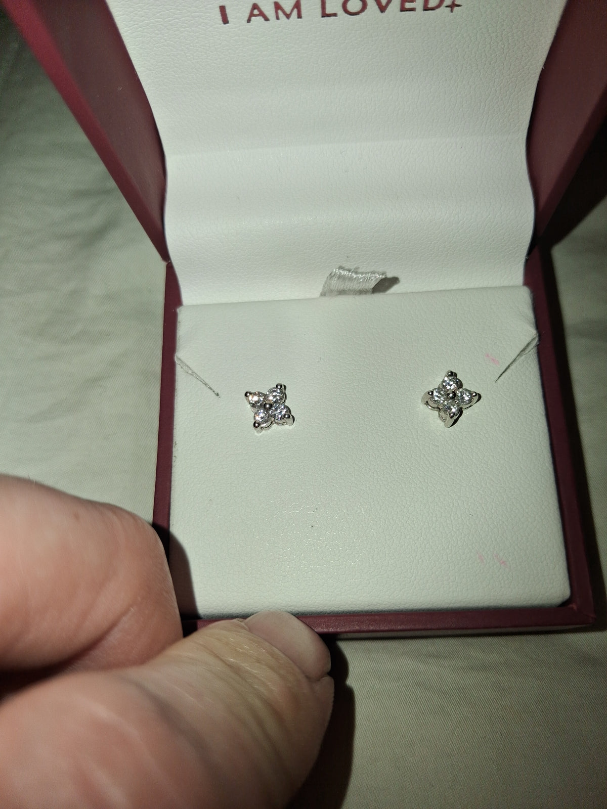 Platinum earrings set high quality natural diamonds 1.4 grams total weight. 💎0.25–0.35 ct per earring → ~0.50–0.70 carat total weight (CTW) for the pair. I had posts moved to middle of earrings so they are unisex.