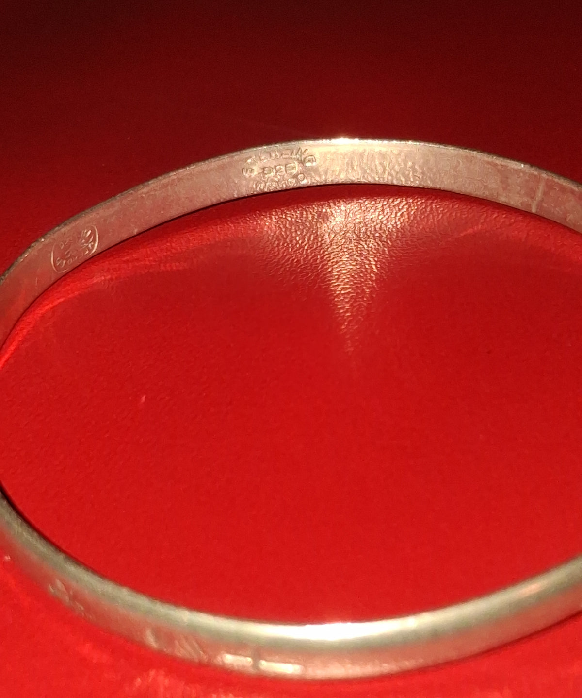 Estate bangle style bracelet. 2-1/2 inches wide. It is stamped 925 silver, but upon testing it contains no precious metals. Its still a beautiful piece at an affordable price.