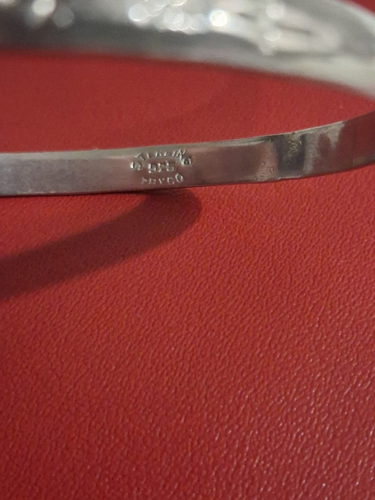 Estate bangle style bracelet. 2-1/2 inches wide. It is stamped 925 silver, but upon testing it contains no precious metals. Its still a beautiful piece at an affordable price.